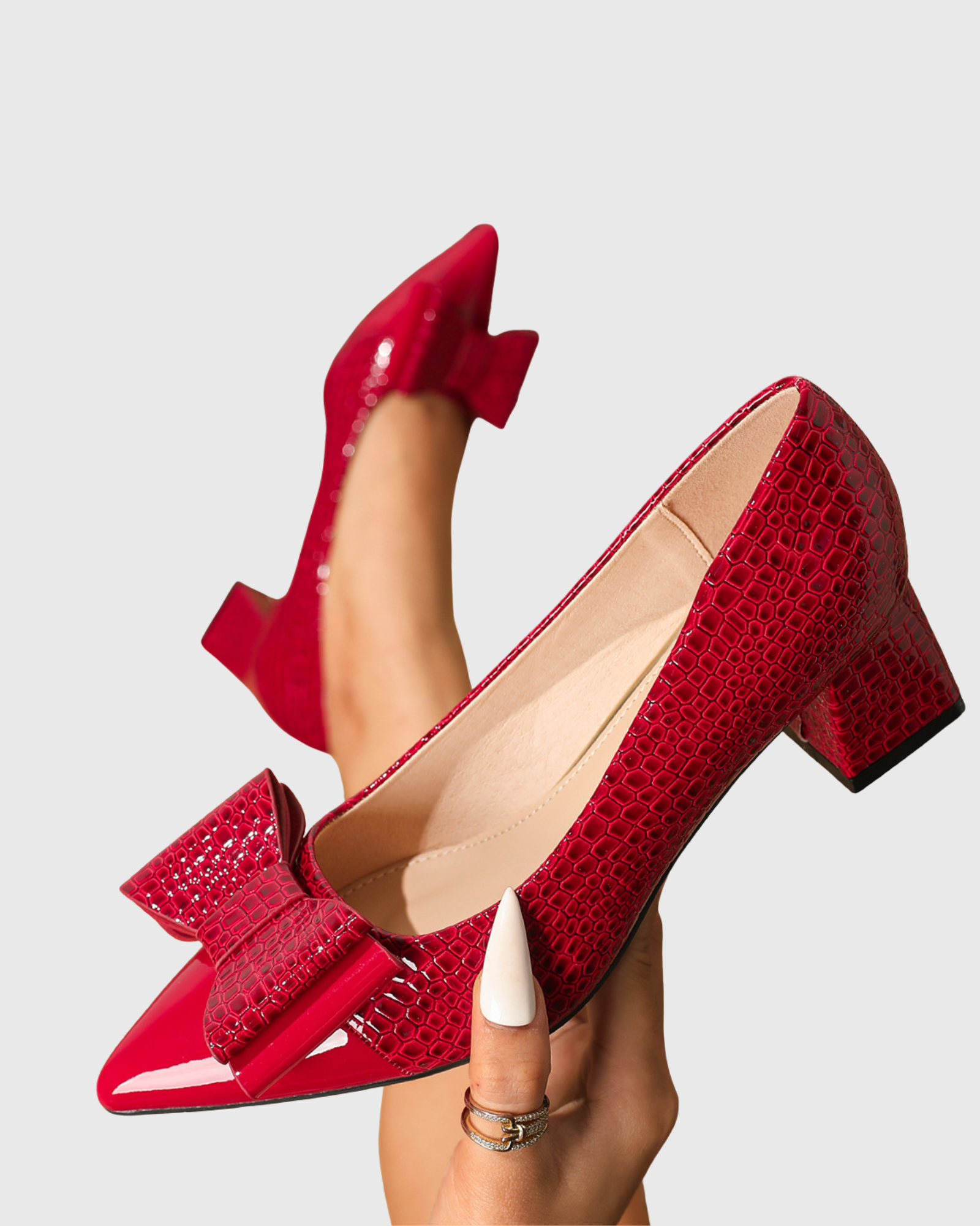Zevala Bow Crocodile Print Pumps In Red