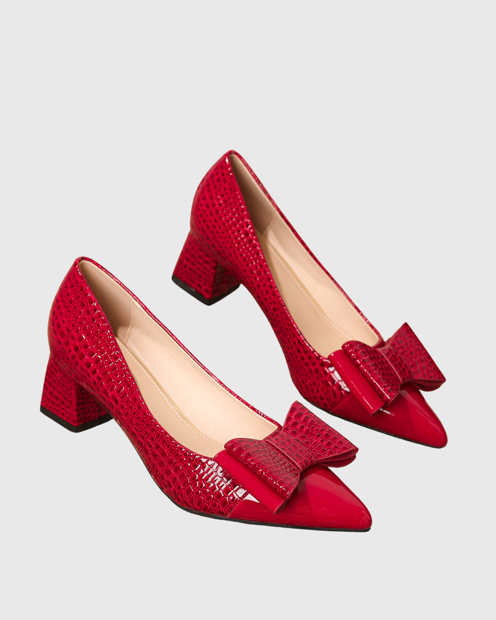 Zevala Bow Crocodile Print Pumps In Red